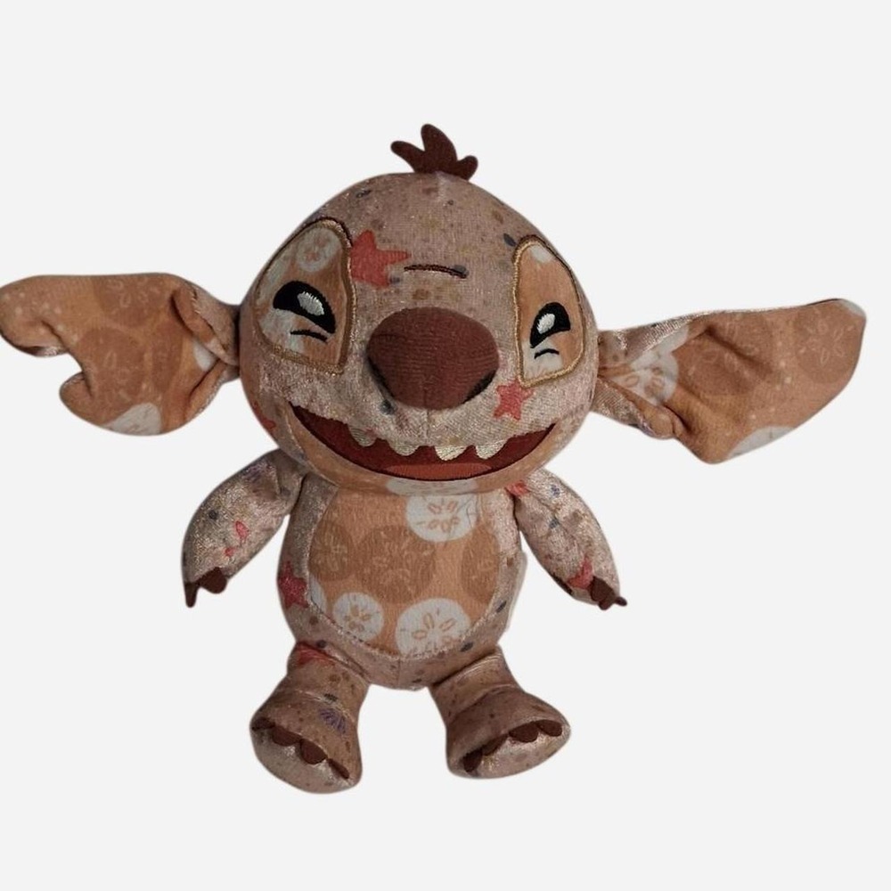 Disney Stitch plush with brown and beige floral pattern